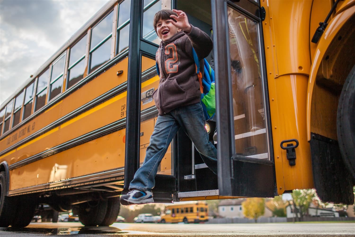 boy exiting bus 