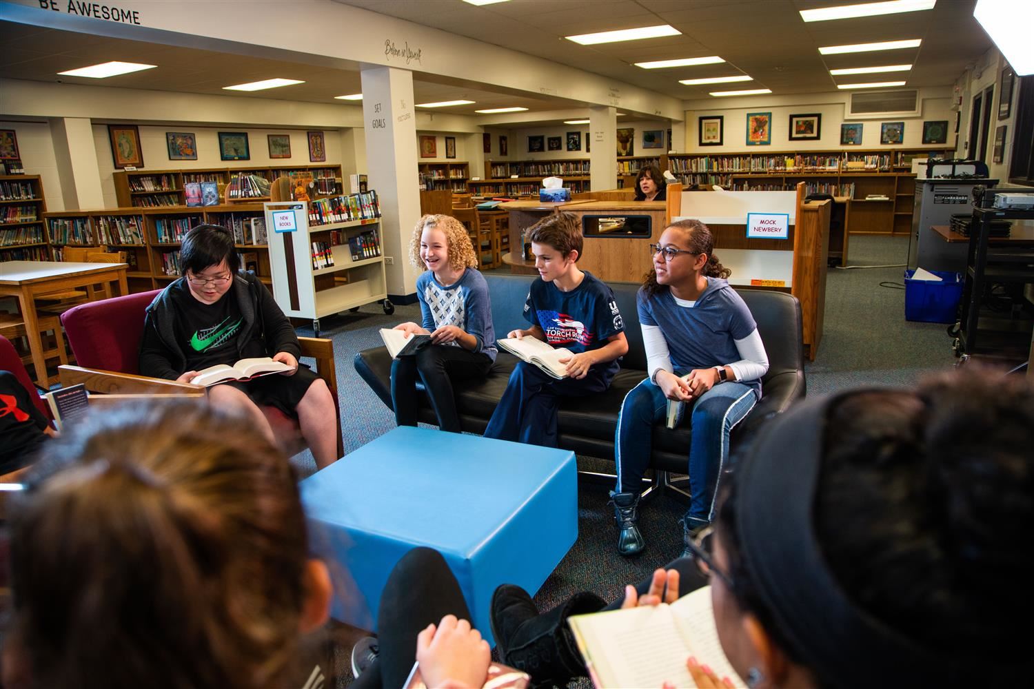 Students reading in a circle Students reading in a circle